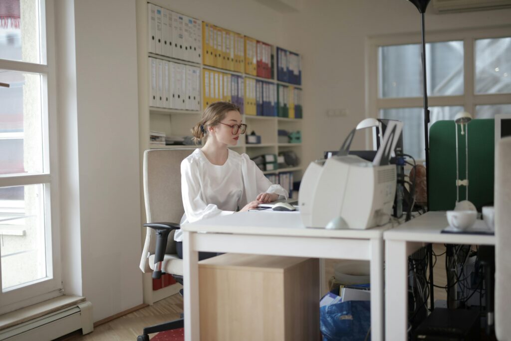 A woman working at her desk.
